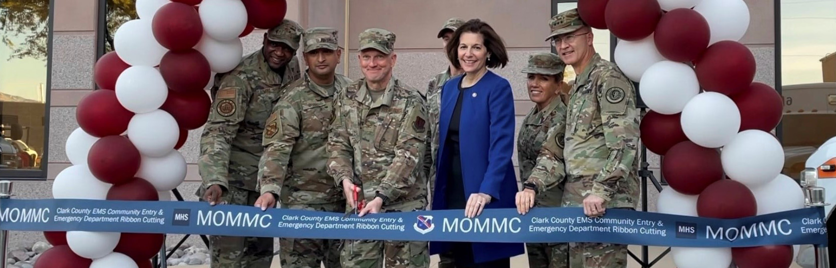 Catherine Cortez Masto stands with troops at a ribbon cutting 2